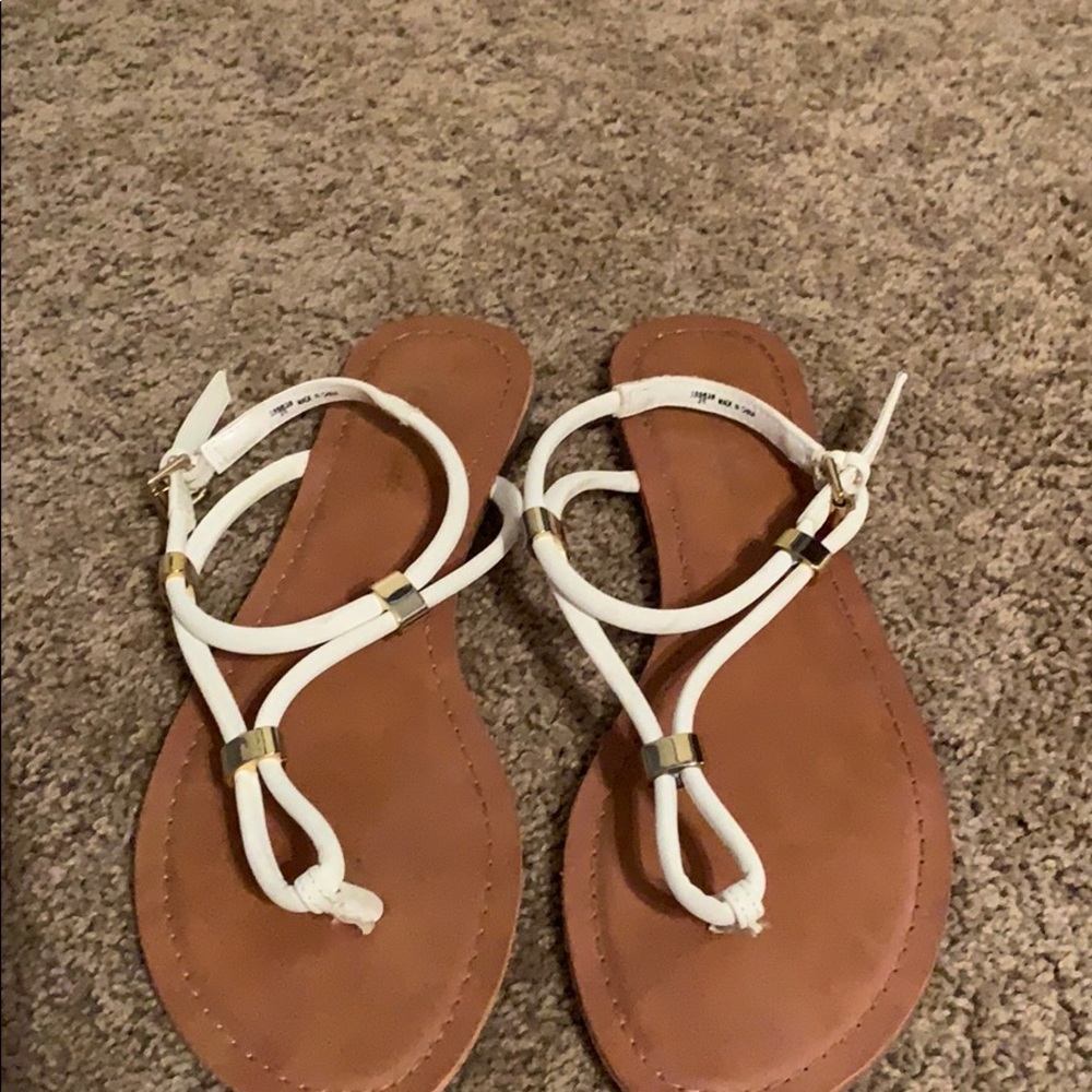 White sandals with gold details